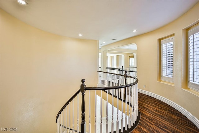 stairway featuring wood-type flooring