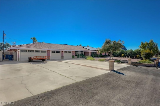 single story home with a garage