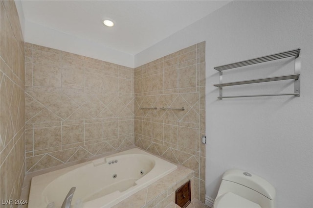 bathroom featuring toilet and tiled bath