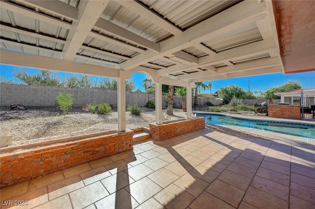 view of patio / terrace with a fenced in pool