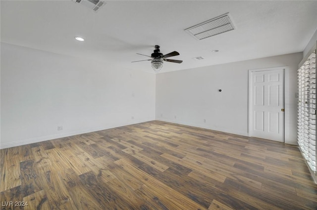 unfurnished room with hardwood / wood-style flooring and ceiling fan