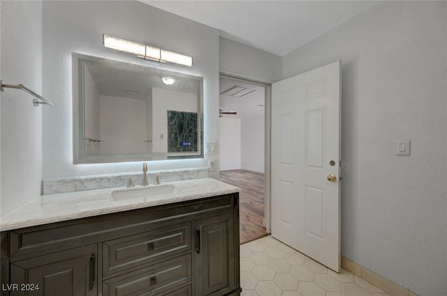 bathroom featuring tile patterned flooring and vanity