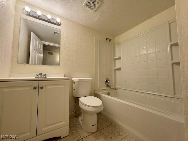 full bathroom with tile patterned floors, vanity, a textured ceiling, tiled shower / bath combo, and toilet