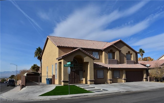 mediterranean / spanish-style house featuring a garage