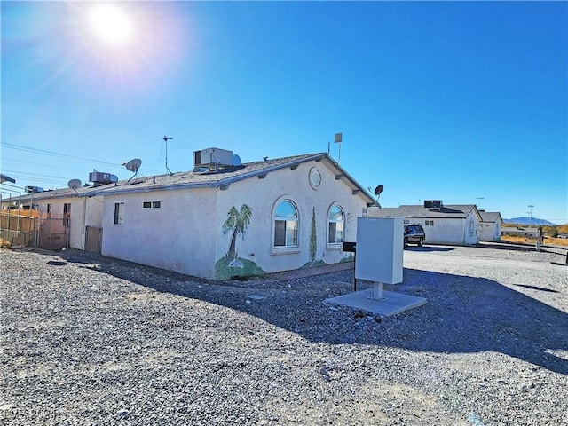 back of property with central air condition unit