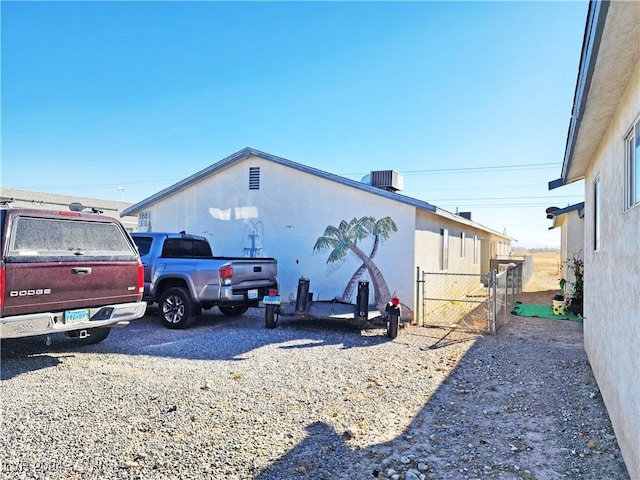 view of side of home featuring central air condition unit