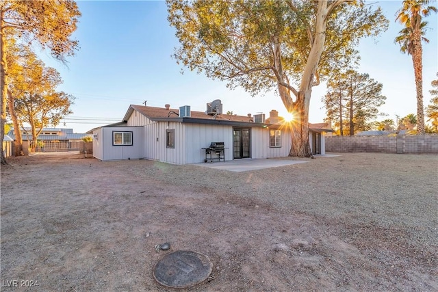 back of house with a patio area