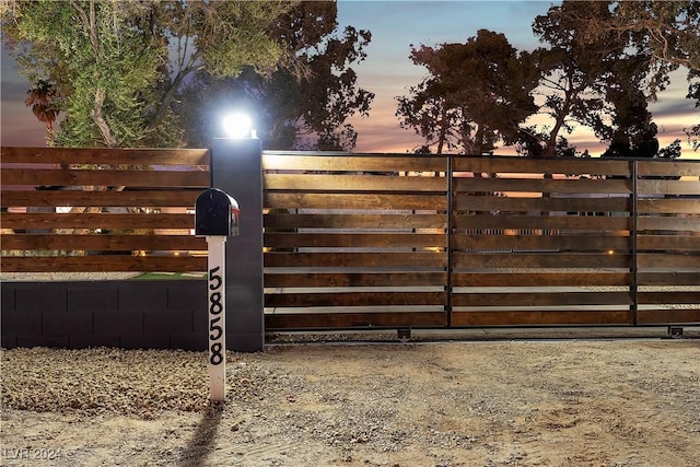 view of gate at dusk