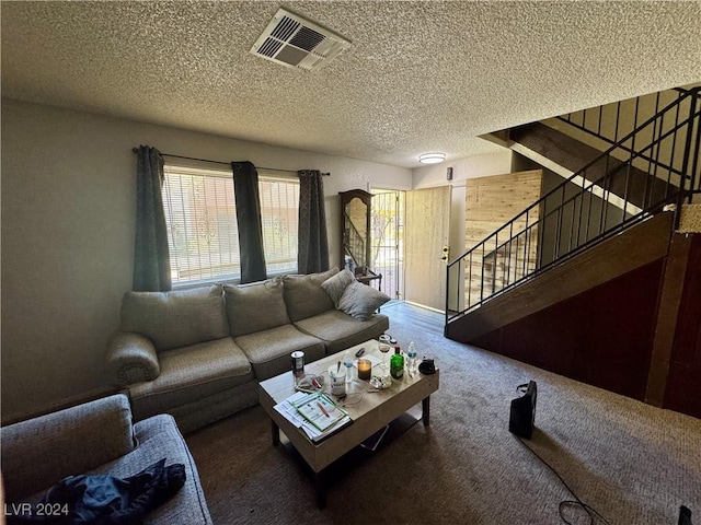 living room with carpet flooring and a textured ceiling