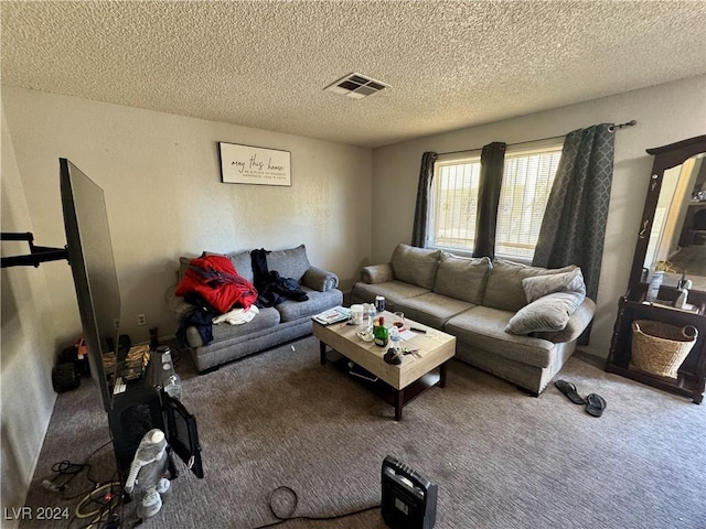 carpeted living room featuring a textured ceiling