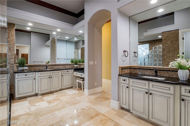 bathroom with vanity and ornamental molding