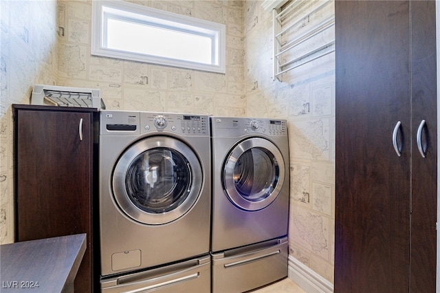 laundry room with independent washer and dryer