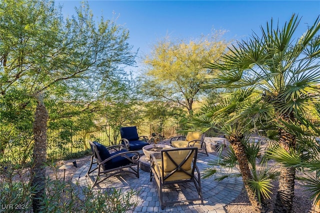 view of patio / terrace featuring an outdoor fire pit