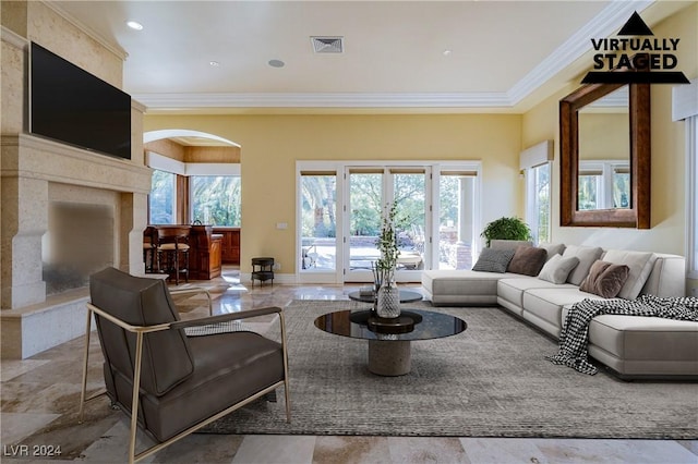 living room featuring ornamental molding and french doors