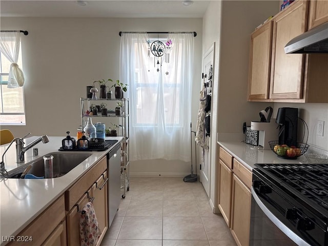 kitchen featuring light tile patterned flooring, ventilation hood, sink, stainless steel dishwasher, and gas stove