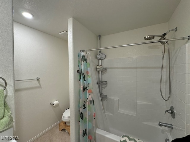 bathroom featuring shower / tub combo with curtain and toilet