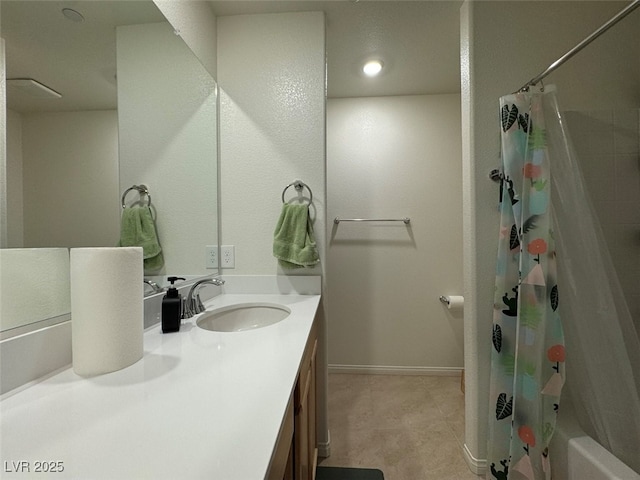 bathroom featuring vanity and shower / bathtub combination with curtain