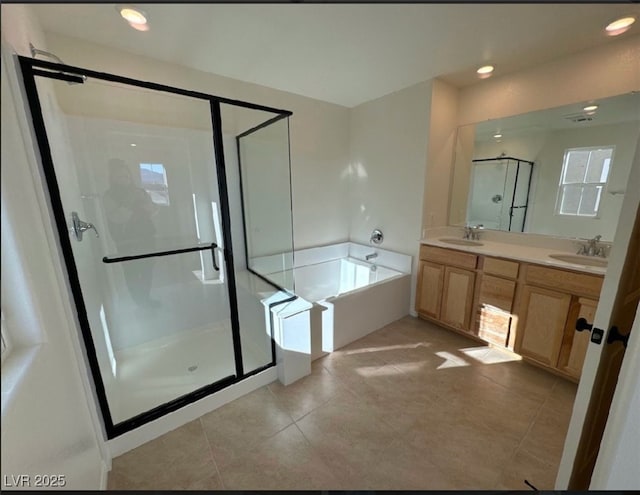 bathroom featuring tile patterned flooring, plus walk in shower, and vanity