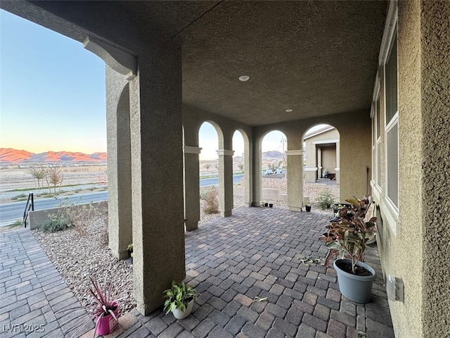 view of patio terrace at dusk