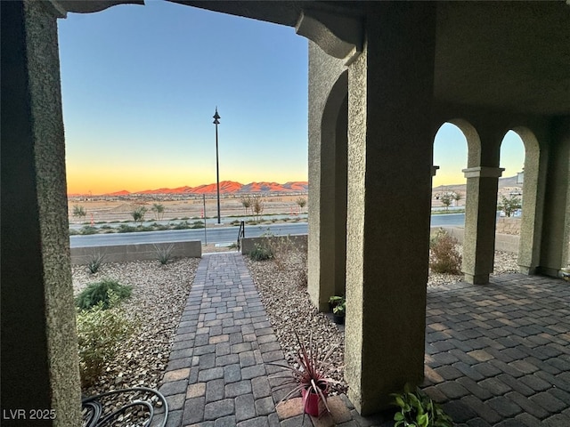 patio terrace at dusk with a mountain view