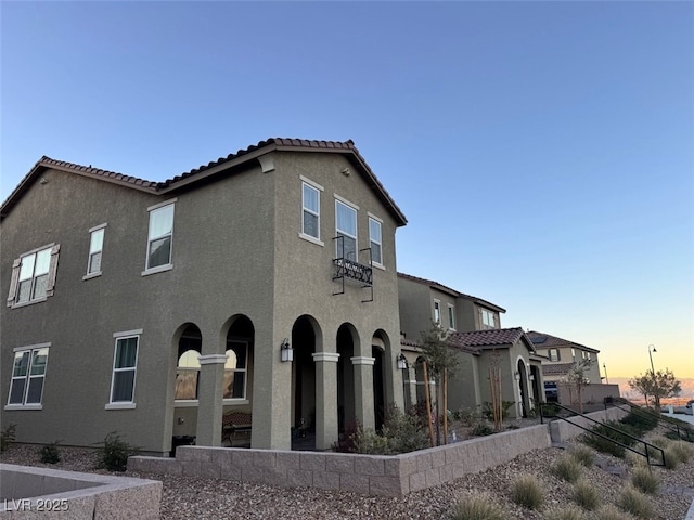 view of property exterior at dusk