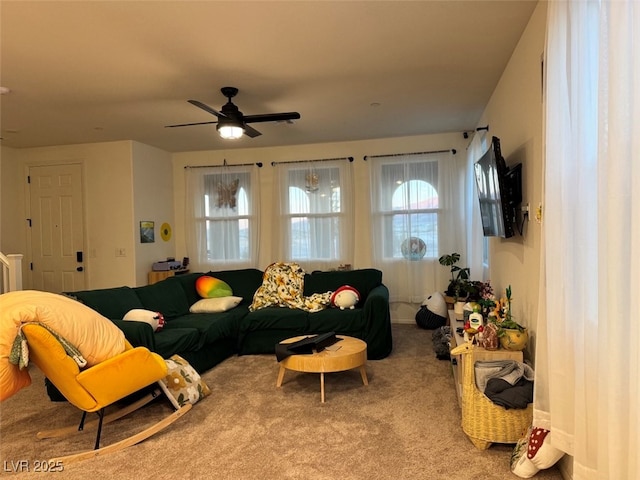 carpeted living room featuring ceiling fan