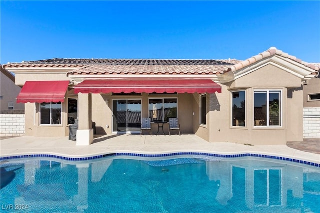 rear view of property with a patio area