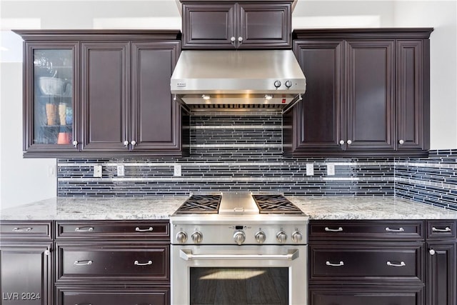 kitchen featuring backsplash, high end stainless steel range, exhaust hood, and dark brown cabinets