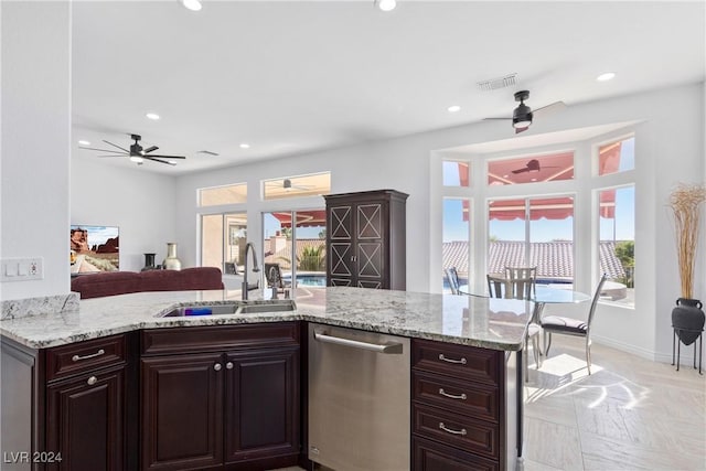 kitchen with stainless steel dishwasher, ceiling fan, dark brown cabinets, and sink