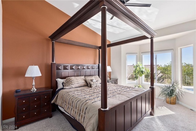 carpeted bedroom featuring vaulted ceiling