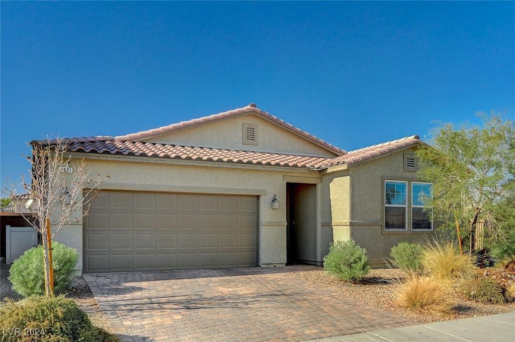 view of front of home with a garage