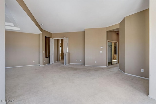 empty room with light colored carpet