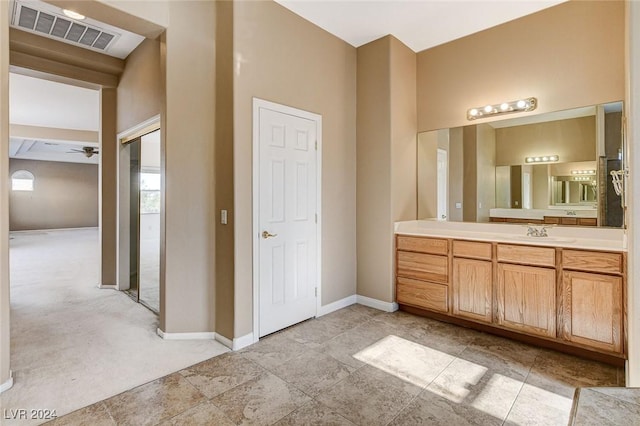 bathroom featuring vanity and ceiling fan