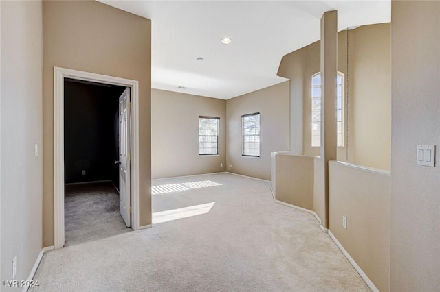 interior space featuring light colored carpet