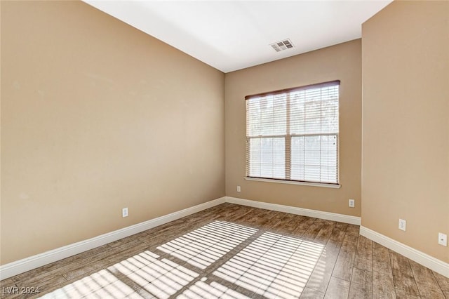 unfurnished room featuring wood-type flooring