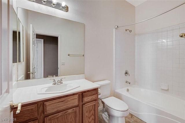 full bathroom featuring tile patterned floors, vanity, tiled shower / bath combo, and toilet