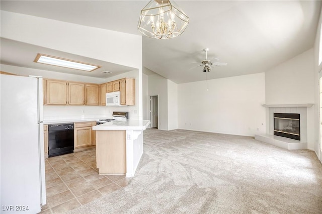 kitchen featuring white appliances, light carpet, a tile fireplace, hanging light fixtures, and light brown cabinetry