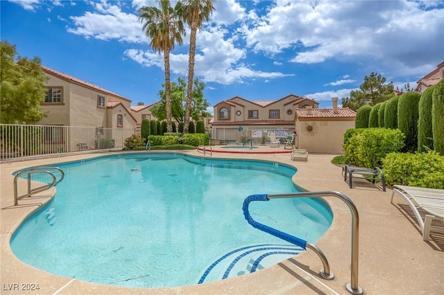 view of swimming pool with a patio