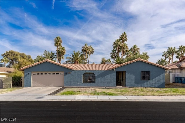 ranch-style home featuring a garage