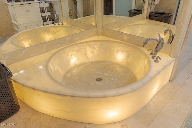 interior details featuring vanity and a washtub