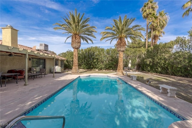 view of swimming pool with a patio