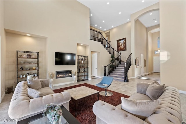 living room with a towering ceiling