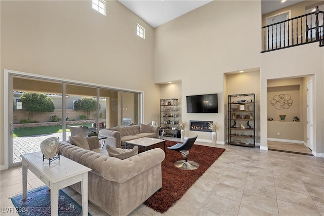 living room featuring a towering ceiling