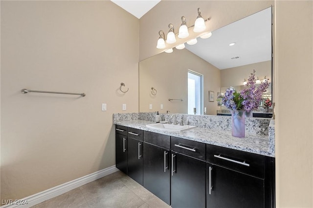 bathroom with tile patterned flooring and vanity