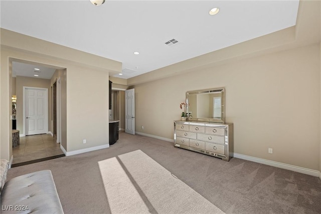 unfurnished bedroom featuring light colored carpet