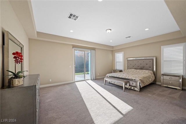 carpeted bedroom featuring access to exterior