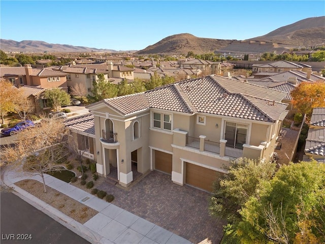 birds eye view of property featuring a mountain view