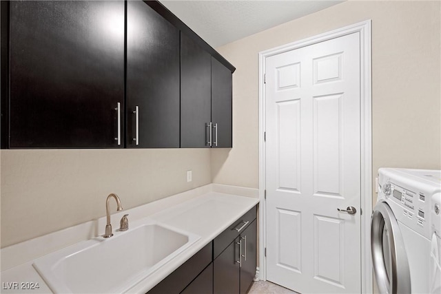 washroom featuring cabinets and sink