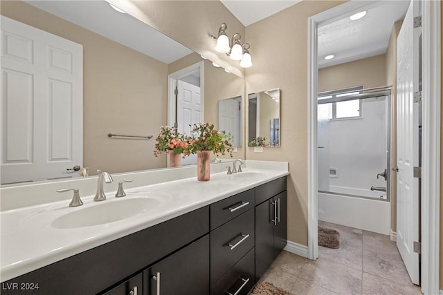 bathroom with tile patterned flooring, bathtub / shower combination, and vanity