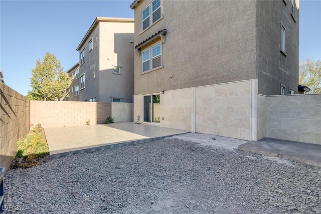 rear view of house with a patio